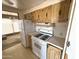 Bright kitchen showcases a gas range, refrigerator, and plenty of upper cabinet space at 6950 W Karen Lee Ln, Peoria, AZ 85382