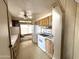 Kitchen featuring white appliances and wood cabinets at 6950 W Karen Lee Ln, Peoria, AZ 85382