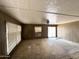 Spacious living room with windows and sliding glass door at 6950 W Karen Lee Ln, Peoria, AZ 85382