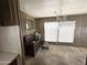 Cozy living room featuring a vintage chandelier and large windows for natural light at 6950 W Karen Lee Ln, Peoria, AZ 85382
