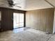 Large living room with sliding glass door provides plenty of natural light and outdoor access at 6950 W Karen Lee Ln, Peoria, AZ 85382