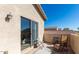 This cozy balcony features stylish outdoor seating, a decorative rug, and a beautiful view at 7117 W Globe Ave, Phoenix, AZ 85043