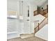 Spacious entryway features high ceilings, an adjacent staircase, and a large window bringing in natural light at 7117 W Globe Ave, Phoenix, AZ 85043