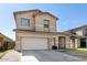 Stunning two-story home with a spacious garage, manicured lawn, and beautiful curb appeal at 7117 W Globe Ave, Phoenix, AZ 85043