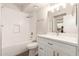 Bathroom featuring a vanity, tub, and tiled shower at 7700 E Gainey Ranch Rd # 102, Scottsdale, AZ 85258