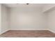 Spacious bedroom featuring wood-look flooring, neutral walls, and modern trim at 7700 E Gainey Ranch Rd # 102, Scottsdale, AZ 85258