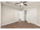Bedroom with wood-look floors, neutral walls, and a large closet at 7700 E Gainey Ranch Rd # 102, Scottsdale, AZ 85258