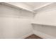 Walk-in closet features ample shelf space and rod for organization at 7700 E Gainey Ranch Rd # 102, Scottsdale, AZ 85258