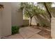 Private courtyard featuring pavers, mature trees, and tasteful landscaping at 7700 E Gainey Ranch Rd # 102, Scottsdale, AZ 85258