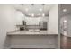 Bright kitchen featuring granite countertops, stainless steel appliances, and ample white cabinetry at 7700 E Gainey Ranch Rd # 102, Scottsdale, AZ 85258