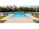 Large community pool with ample seating and landscaping at 7700 E Gainey Ranch Rd # 102, Scottsdale, AZ 85258