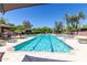 Sparkling pool surrounded by lounge chairs and lush landscaping, offering a resort-style experience at 7700 E Gainey Ranch Rd # 102, Scottsdale, AZ 85258