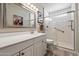 Nicely updated bathroom with a vanity, mirror, glass enclosed shower at 7736 E Hazelwood St, Scottsdale, AZ 85251