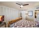 Charming bedroom featuring a decorative bedspread, closet and view of the bathroom at 7736 E Hazelwood St, Scottsdale, AZ 85251
