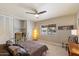 Comfortable bedroom with a bed, ceiling fan, and nice view from the window at 7736 E Hazelwood St, Scottsdale, AZ 85251