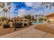 Well-maintained community pool with shaded seating areas, offering a refreshing escape and social gathering spot at 7736 E Hazelwood St, Scottsdale, AZ 85251
