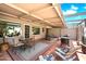 Charming covered patio with lounge chairs and outdoor dining set, ideal for relaxation and entertaining at 7736 E Hazelwood St, Scottsdale, AZ 85251