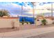 Charming entrance with decorative gate, lush greenery, and a welcoming pathway to the building at 7736 E Hazelwood St, Scottsdale, AZ 85251