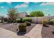 Well-maintained front yard with desert landscaping, gravel, shrubs, and a concrete pathway to the front door at 7736 E Hazelwood St, Scottsdale, AZ 85251
