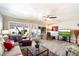 Inviting living room with a comfortable leather sofa and bright natural light, perfect for relaxation at 7736 E Hazelwood St, Scottsdale, AZ 85251