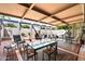 Large outdoor patio with dining and seating areas, offering a perfect space for entertaining guests at 7736 E Hazelwood St, Scottsdale, AZ 85251