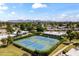 Aerial view of tennis courts and surrounding community, set against mountain backdrop at 7856 E Via Marina --, Scottsdale, AZ 85258