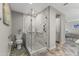 Modern bathroom featuring a glass-enclosed shower, updated fixtures, and accessible grab bars at 7856 E Via Marina --, Scottsdale, AZ 85258