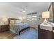 Inviting bedroom with a comfortable bed, hardwood floors, and soft lighting at 7856 E Via Marina --, Scottsdale, AZ 85258