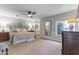 Spacious bedroom with a ceiling fan, carpeted floors, and large windows at 7856 E Via Marina --, Scottsdale, AZ 85258