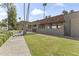 A gated community entrance with a pergola over a grassy area at 7856 E Via Marina --, Scottsdale, AZ 85258