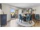 Inviting dining room with stylish blue chairs, sliding glass doors, and elegant furnishings at 7856 E Via Marina --, Scottsdale, AZ 85258