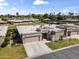 Aerial view of a desert home featuring a two-car garage and well-manicured lawn at 7856 E Via Marina --, Scottsdale, AZ 85258