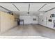 Spacious garage with ample storage cabinets and speckled epoxy flooring at 7856 E Via Marina --, Scottsdale, AZ 85258