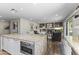Open kitchen featuring granite countertops, stainless steel appliances, and a seamless flow into the cozy living area at 7856 E Via Marina --, Scottsdale, AZ 85258