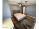 Bedroom with bed, gray walls, and wood floors at 8103 E Southern Ave # 157, Mesa, AZ 85209