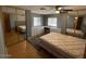 Bedroom with bed, built-in dresser, carpet, and mirrored closet doors at 8103 E Southern Ave # 157, Mesa, AZ 85209