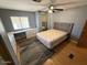 Bedroom featuring a large bed, desk, and natural light at 8103 E Southern Ave # 157, Mesa, AZ 85209