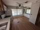 Bright kitchen featuring white appliances, window, hardwood floors, and neutral decor at 8103 E Southern Ave # 157, Mesa, AZ 85209