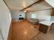 Comfortable living room with wood laminate flooring and a modern fireplace at 8103 E Southern Ave # 157, Mesa, AZ 85209