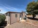 Back exterior of cozy home with an AC unit and low-maintenance landscaping at 8103 E Southern Ave # 157, Mesa, AZ 85209