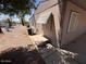Exterior rear of cozy home with AC unit and low-maintenance desert landscaping at 8103 E Southern Ave # 157, Mesa, AZ 85209