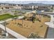 Aerial view showcases a neighborhood playground with swings, slides, and surrounding residential homes at 8149 E Petunia Ave # 1057, Mesa, AZ 85212