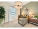 View of a charming Bedroom with a crib, natural light and decor at 8149 E Petunia Ave # 1057, Mesa, AZ 85212