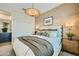 Inviting main bedroom features stylish lighting, a decorative accent wall, and neutral decor at 8149 E Petunia Ave # 1057, Mesa, AZ 85212