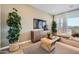Cozy living room with modern decor, a large TV, and comfortable seating at 8149 E Petunia Ave # 1057, Mesa, AZ 85212