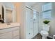 Modern bathroom features glass enclosed shower, sleek vanity, and contemporary finishes at 8331 E Petunia Ave, Mesa, AZ 85212