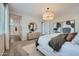 Well-lit bedroom with neutral tones, decorative mirror, and plush carpeting at 8331 E Petunia Ave, Mesa, AZ 85212