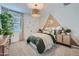 Comfortable bedroom featuring stylish decor, a cozy bed, and natural lighting at 8331 E Petunia Ave, Mesa, AZ 85212