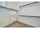 Spacious walk-in closet with ample shelving and hanging space, ready for organization at 8331 E Petunia Ave, Mesa, AZ 85212