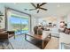 Bright and open living room with a large sliding glass door leading to the backyard at 8331 E Petunia Ave, Mesa, AZ 85212